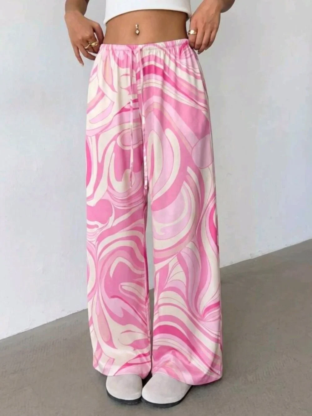 Women's loose-fitting satin pants with a low rise